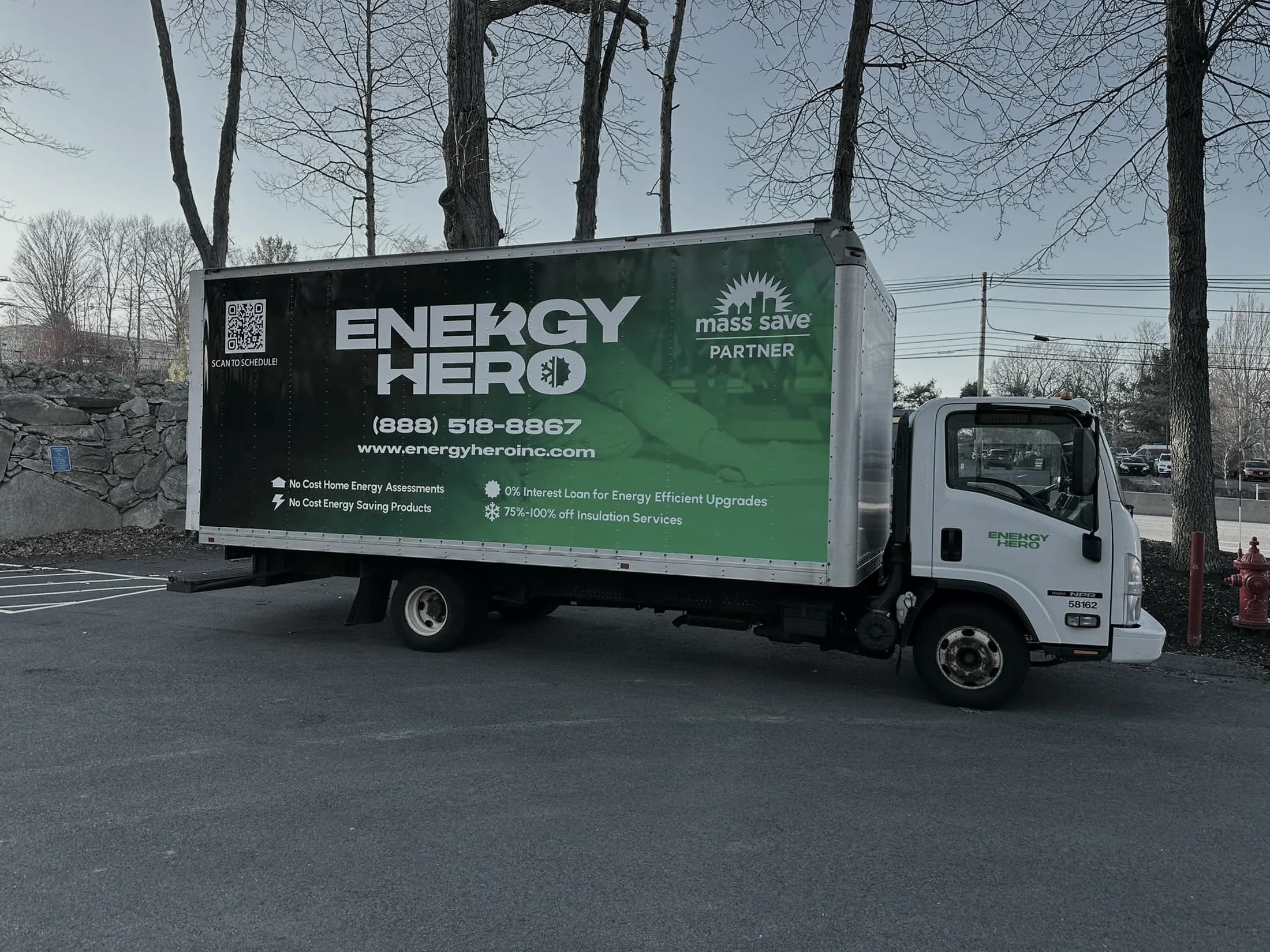 Energy Hero technician air sealing a home