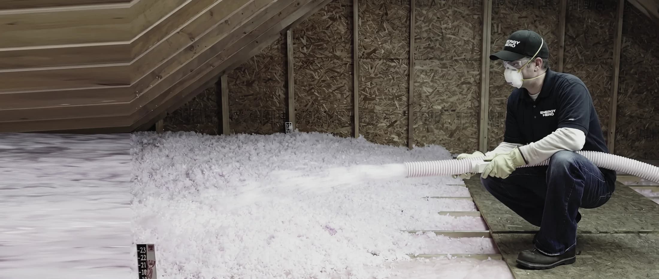 Energy Hero technician spraying attic insulation