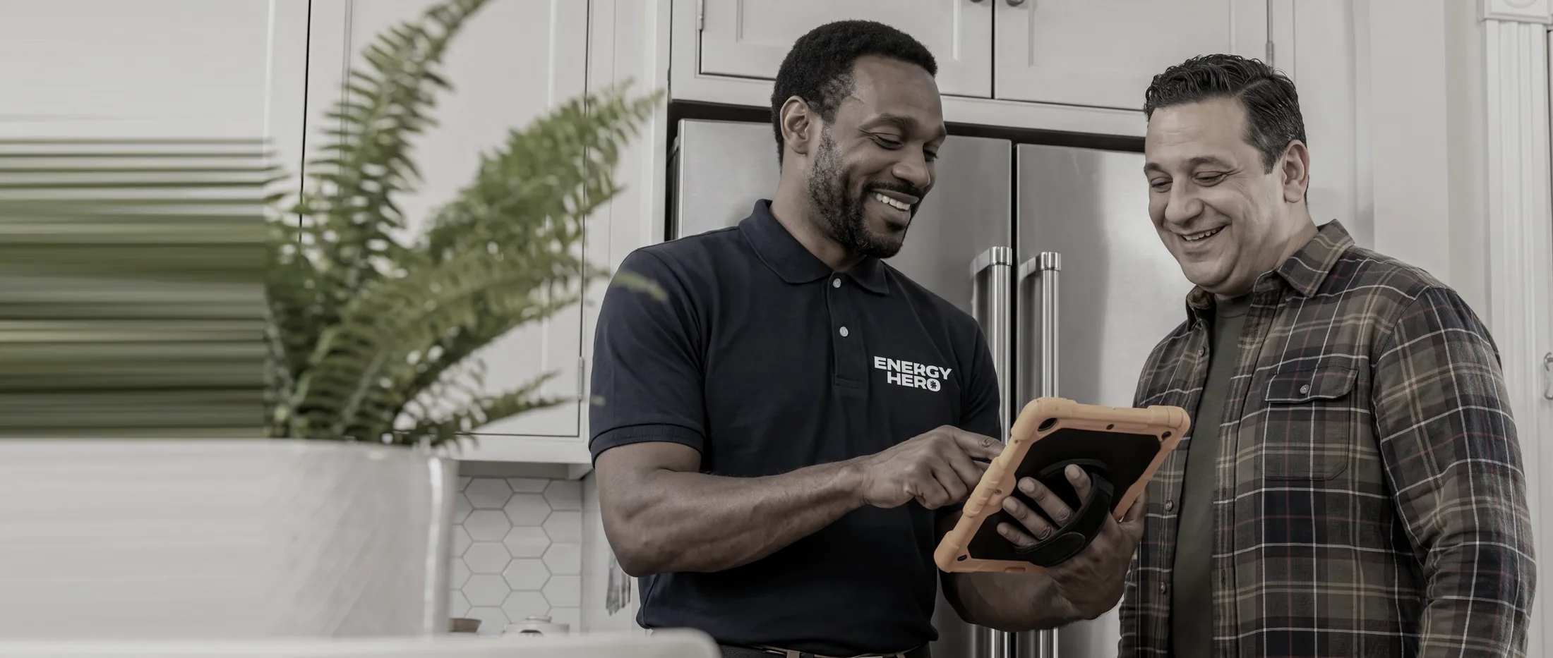 Energy Hero specialist reviewing an assessment with a homeowner
